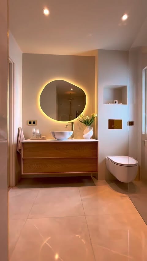 Instagram post by @regine_monet.fit for West Elm. Caption reads: [...] → curved mirror clean + modern The @westelm....