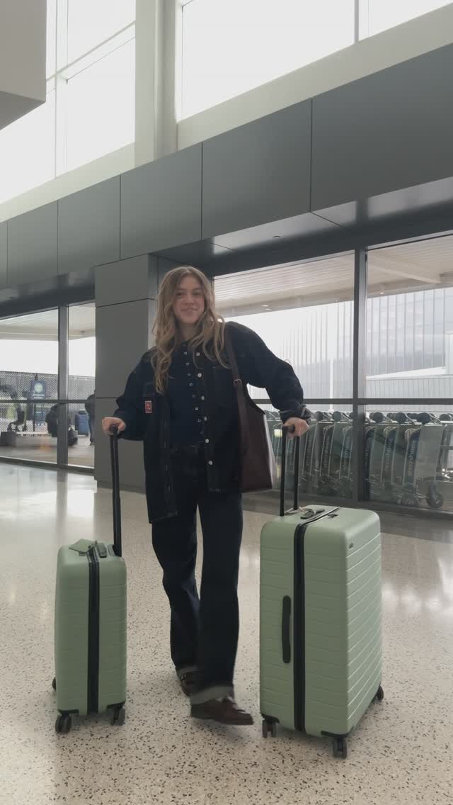 Instagram post by @anna_barger for Away. Caption reads: [...] solo travel vlog with my @away luggage....