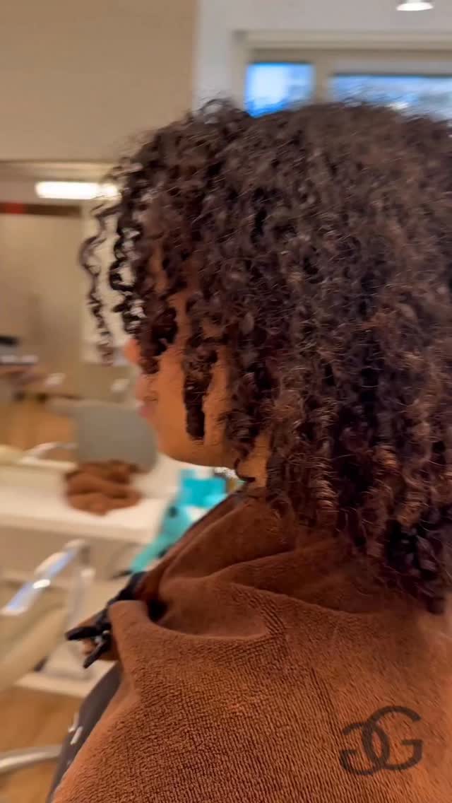 Instagram post by @greg_gilmore for Moroccanoil Professionals. Caption reads: Did you notice how much her curls elongated ?!....