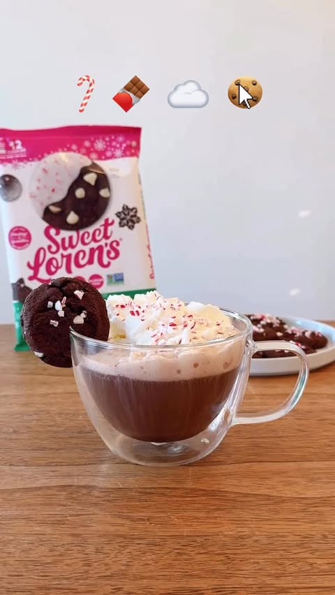 Instagram post by @thethirstygals for Sweet Loren's. Caption reads: SPIKED PEPPERMINT HOT COCOA 🍪💚

Holiday magic in....