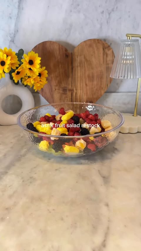 Instagram post by @galiciagordon for Fruit Riot. Caption reads: asmr fruit salad restock ft. @fruitriot ❤️....