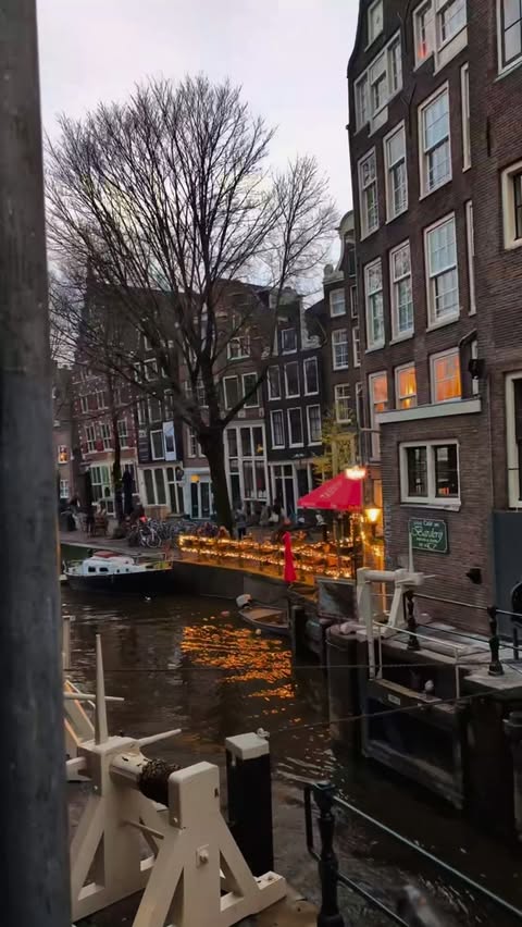 Instagram post by @_wanderlustandwhiskey for Luxury Escapes. Caption reads: Who's dreaming of Amsterdam for 2026?

This....