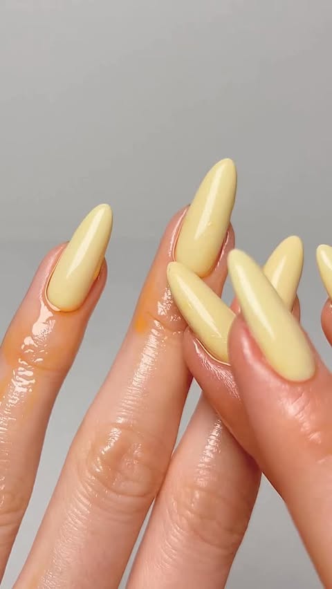Instagram post by @thehotblend for essie. Caption reads: Ad. Butter yellow nails for spring 💛 @essie....