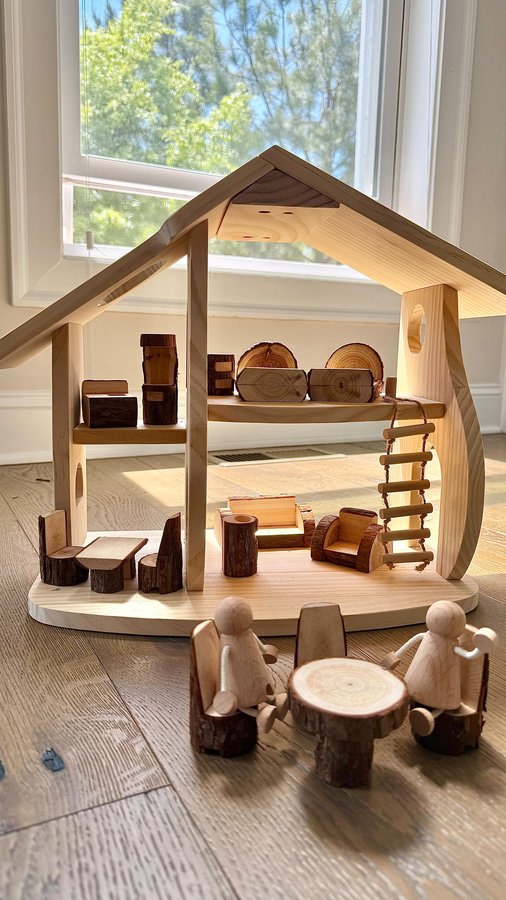 Instagram post by @lovinglylina for Guidecraft. Caption reads: [...] toys like this wooden dollhouse from....