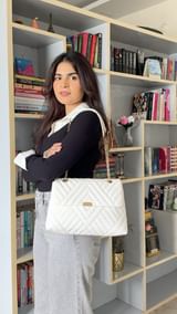 Instagram post by @justmahnaz for Lino Perros. Caption reads: [...] 🥰 

shop the bag & heel now only at....