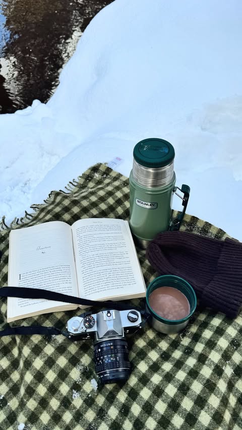 Instagram post by @apkipps for Le Creuset. Caption reads: A slow dark morning spent reading, the smell of....