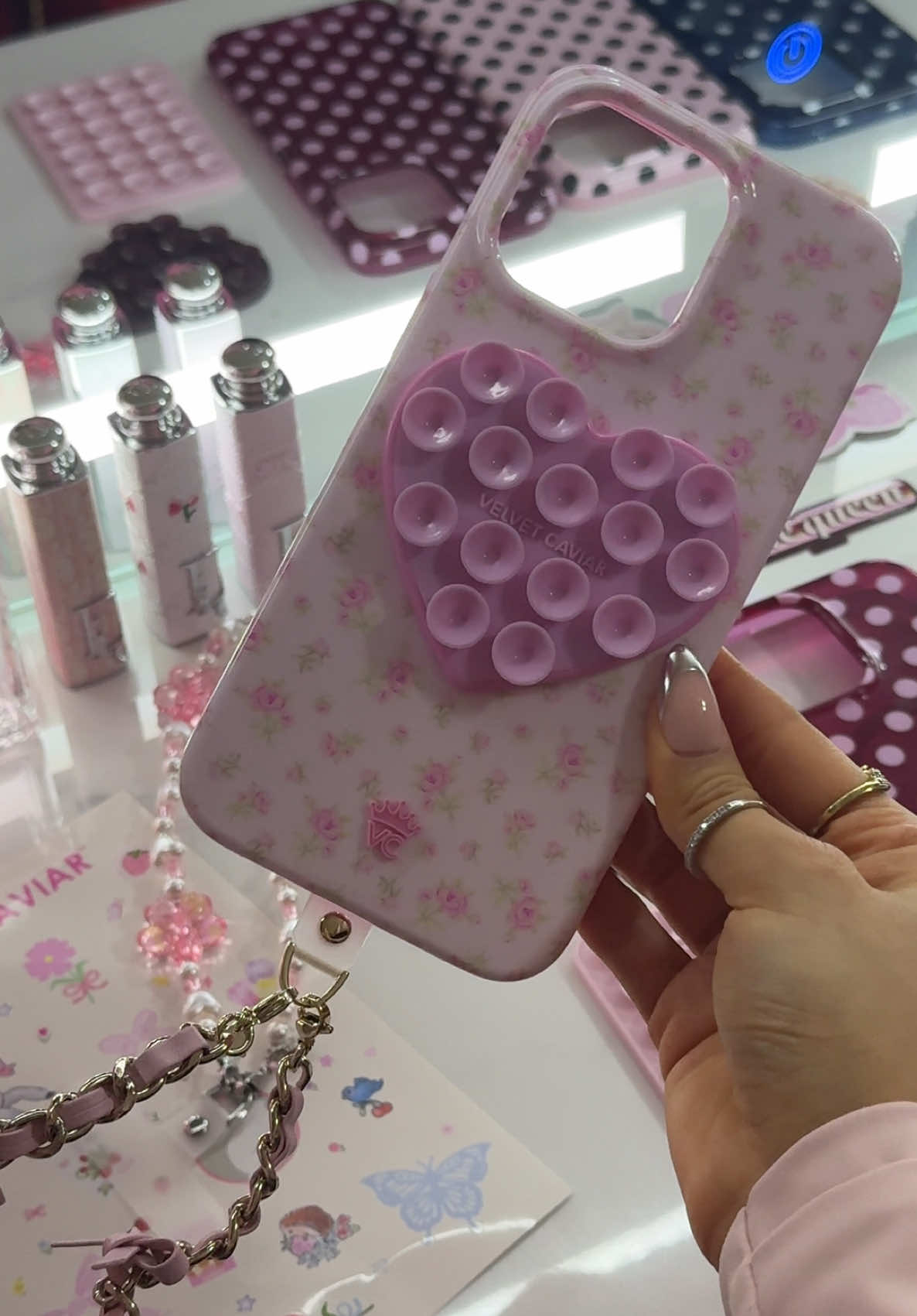 TikTok post by @carlaflor3s for VELVET CAVIAR. Caption reads: the cutest phone case 🌷🪽🤍 @velvetcaviar....