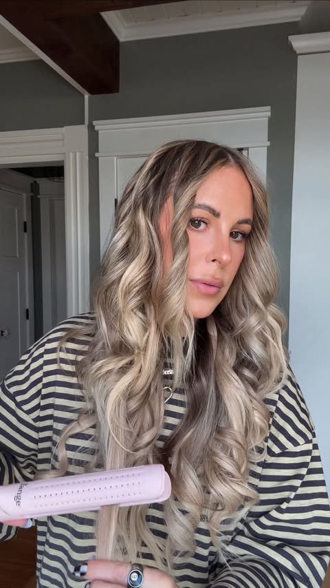 Instagram post by @torielynnbliss for L'ange Hair. Caption reads: I’ve never been able to do straightener curls....