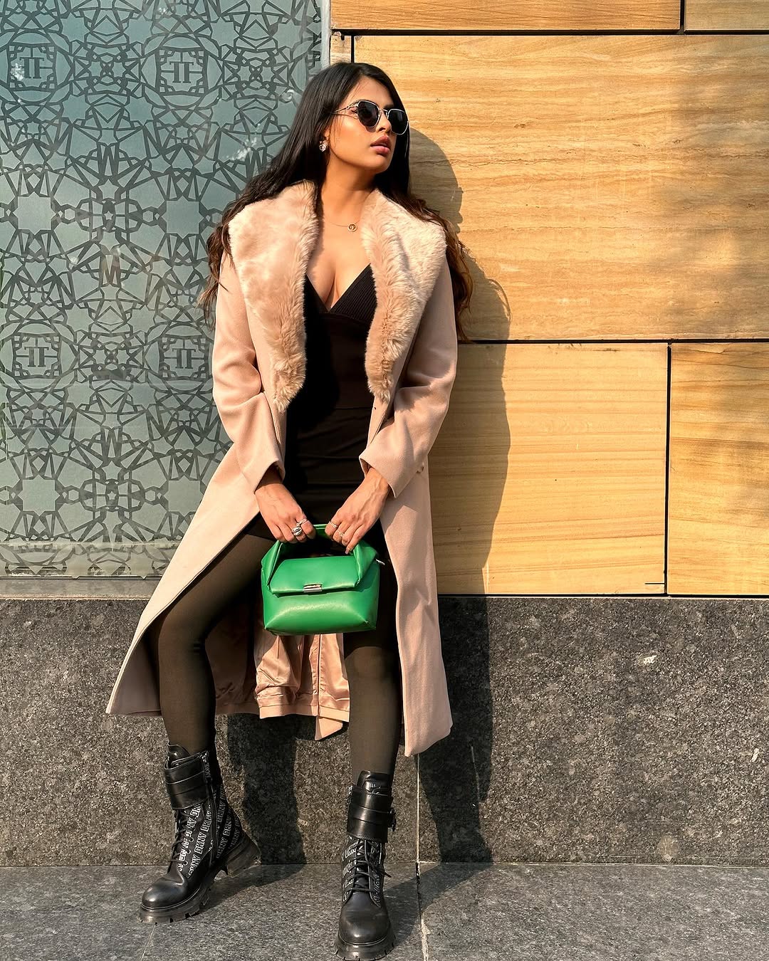 Instagram post by @_love.esha for DKNY. Caption reads: Confidence in hand, style in tow. Embracing the....