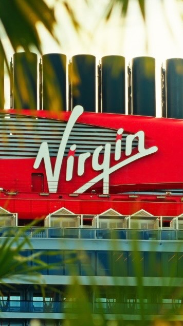 Instagram post by @aricogen for Virgin Voyages. Caption reads: CRUISING THE CARIBBEAN @virginvoyages a few months....
