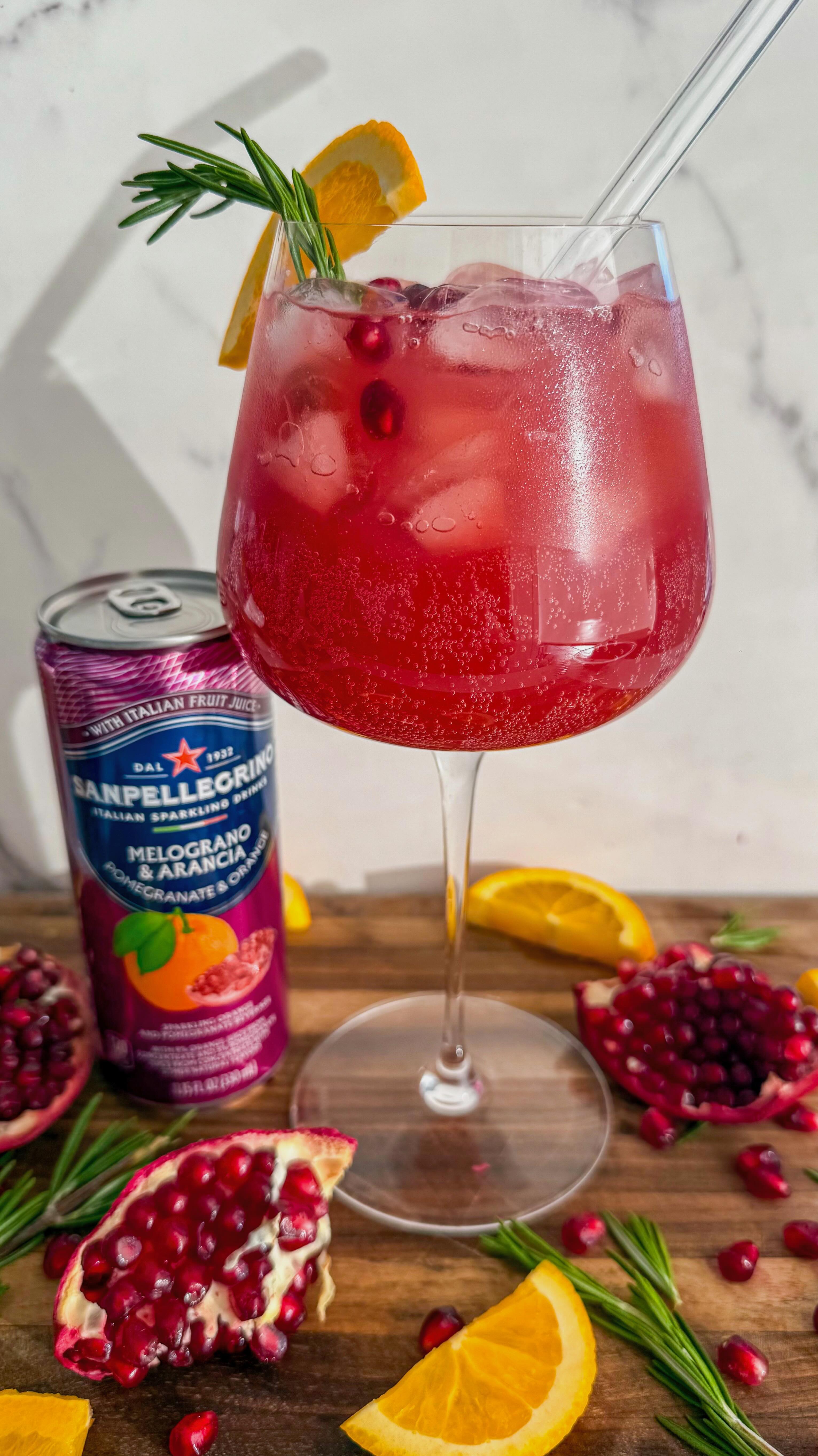 Instagram post by @alexawhatsfordinner for Sanpellegrino. Caption reads: (#SPpartner 21+) These Batched Pomegranate Orange....