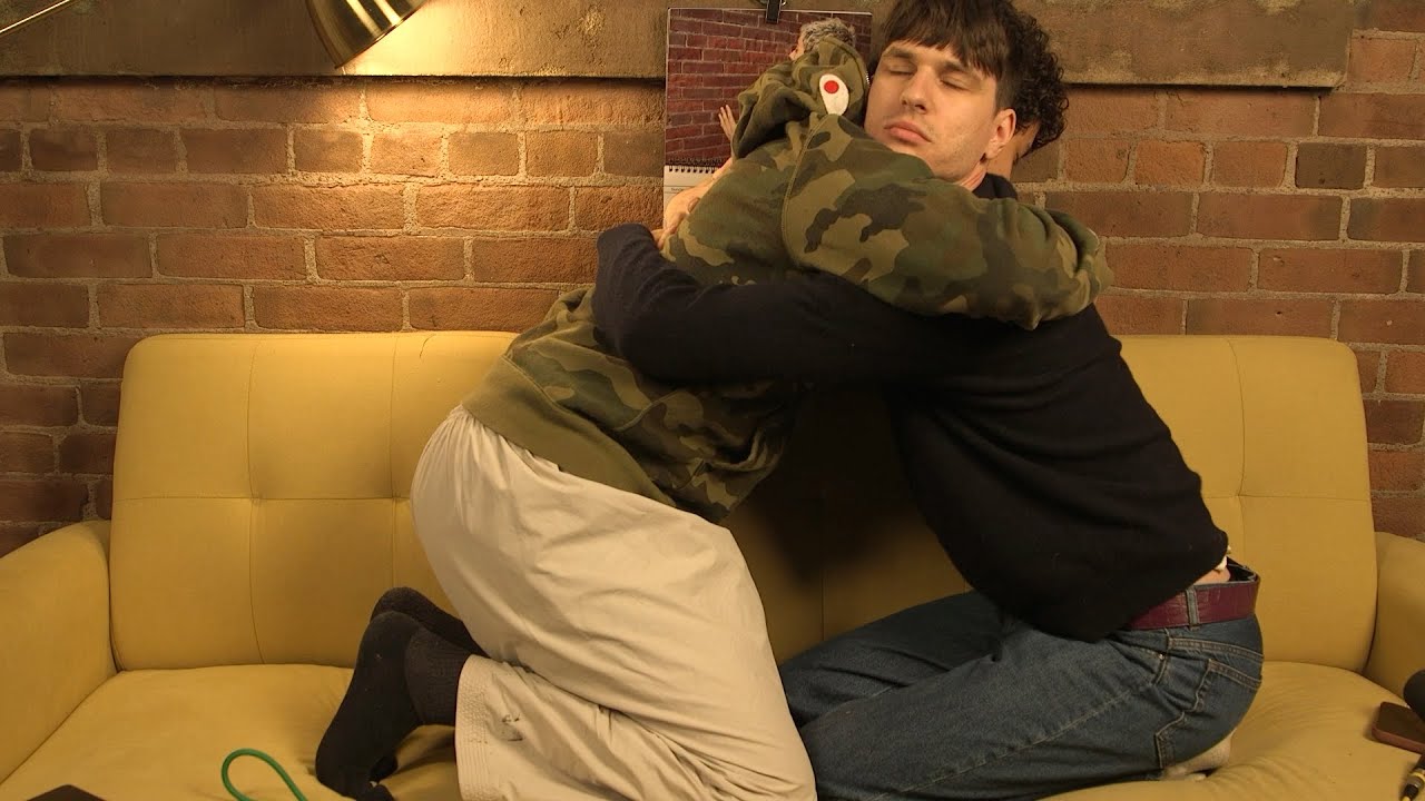 YouTube post by @OutofCharacter for Rocket Money. Caption reads: Hugs and Movies - Out of Character .