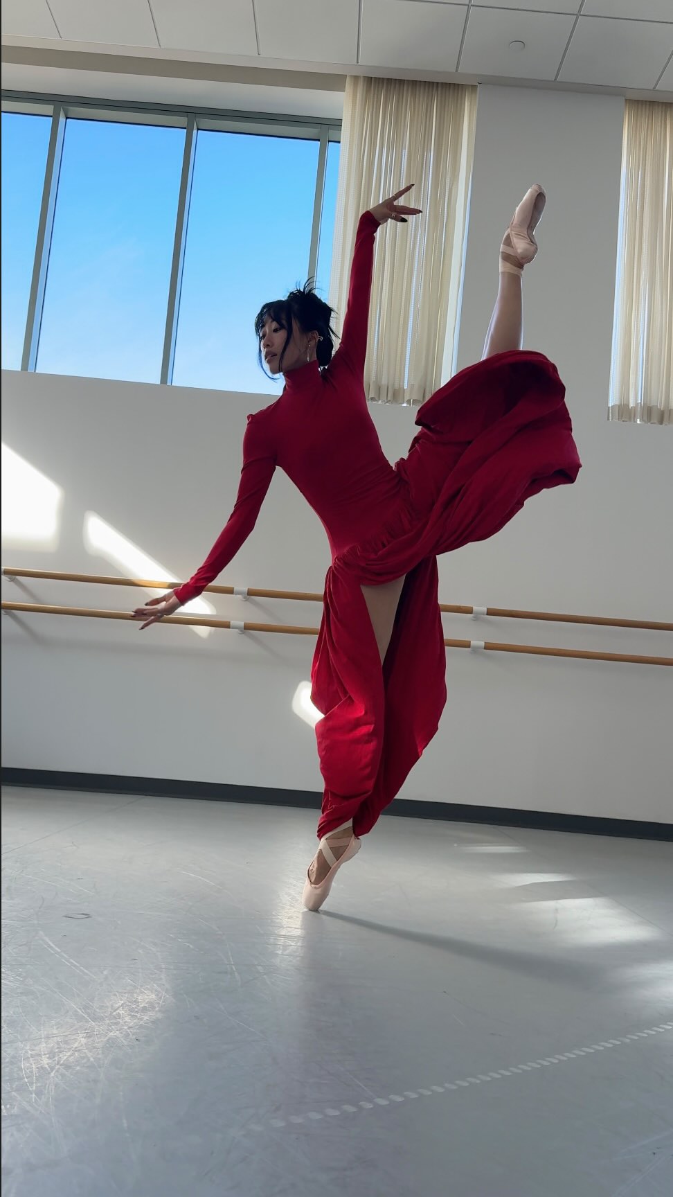 Instagram post by @maddwoo for NET-A-PORTER. Caption reads: catch me twirling through the holidays with....