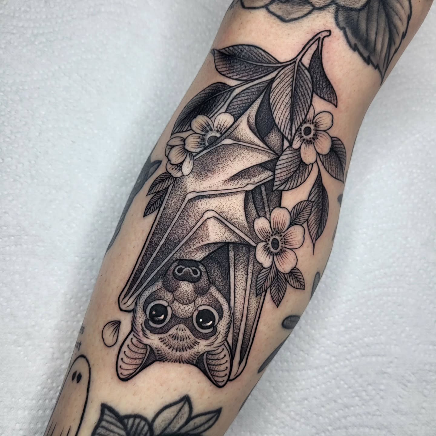 Instagram post by @ali_burke_tattoo for Butterluxe Tattoo Care. Caption reads: Lil hanging batty for Hollie @holliespetcrew this....