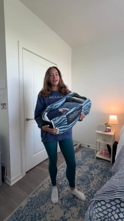 Instagram post by @ainsleyczarnecki for Nuuly. Caption reads: let’s unpack this months #nuulypicks #relateable....