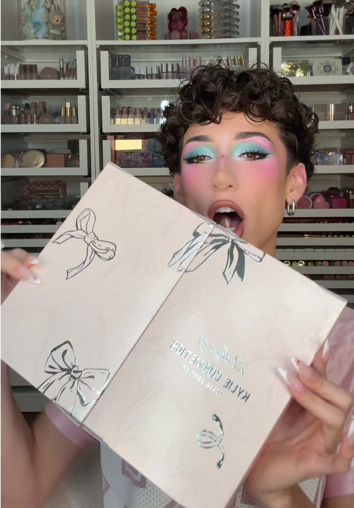 TikTok post by @daus_mendoza for Kylie Cosmetics. Caption reads: UNBOXING and REVIEWING the @Kylie Cosmetics 2025....