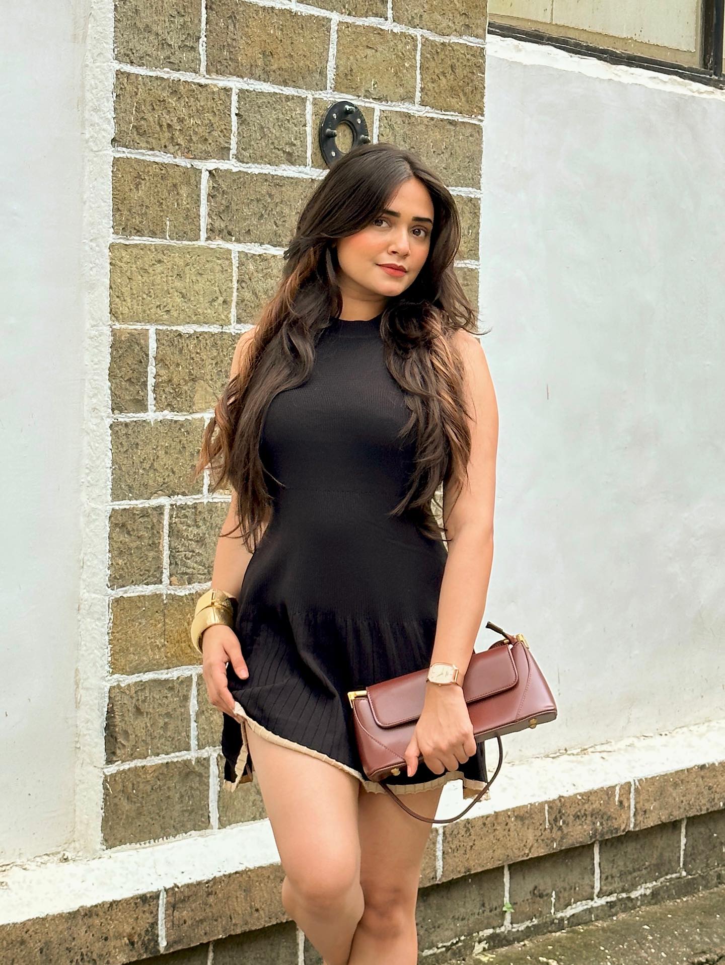 Instagram post by @pooja.jainn_ for Daniel Wellington. Caption reads: Chic, timeless, and always in style ✨....