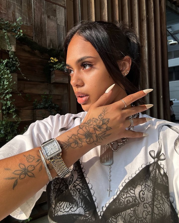 Instagram post by @tifffanyhelena for JBW. Caption reads: only time will tell @jbwwatches 🙇🏽‍♀️.