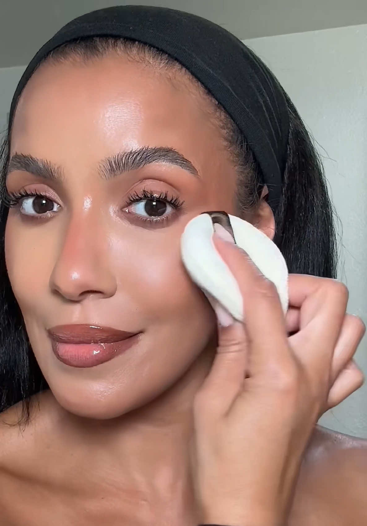 TikTok post by @officialjulissab for Laura Mercier. Caption reads: I’m all about intentional powder placement these....
