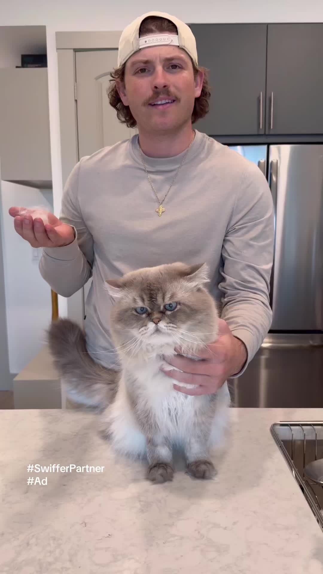 TikTok post by @gasperandgus for Swiffer. Caption reads: #SwifferPartner #Ad Pets will be pets, but a mess....