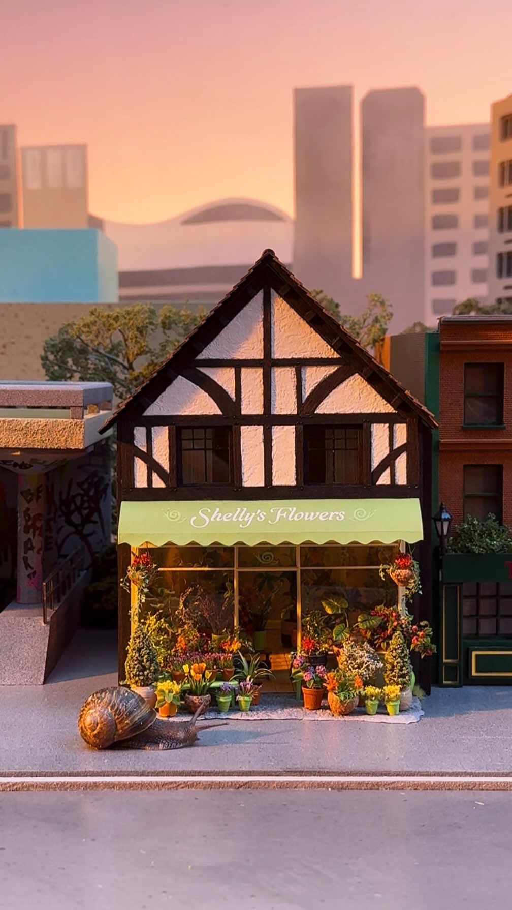 Instagram post by @hannahlemon_art for Wise. Caption reads: I made a miniature florist for snails!
Built a....