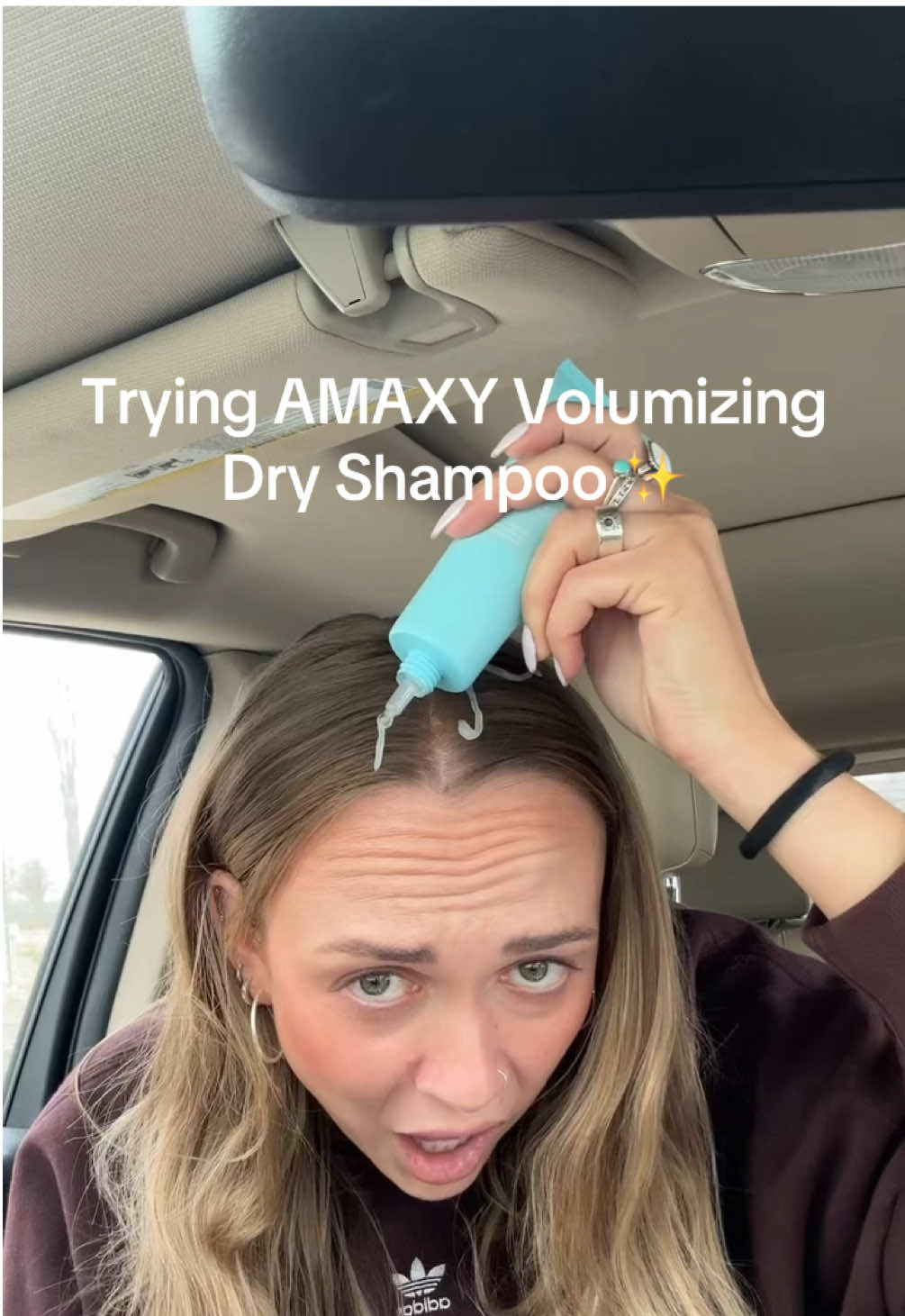 TikTok post by @jordynnlea for AMAXY Beauty. Caption reads: Trying the AMAXY Volumizing Dry Shampoo 👀 Used a....