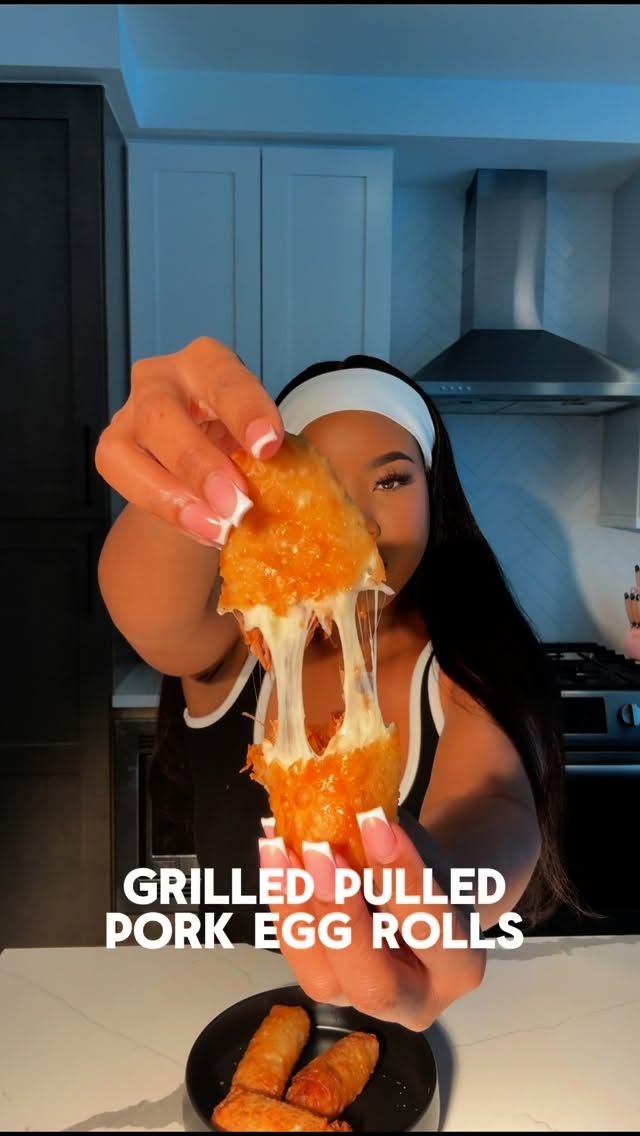 Instagram post by @cookingwithdestiny for Soulful Pork. Caption reads: These grilled pulled pork egg rolls are a must....