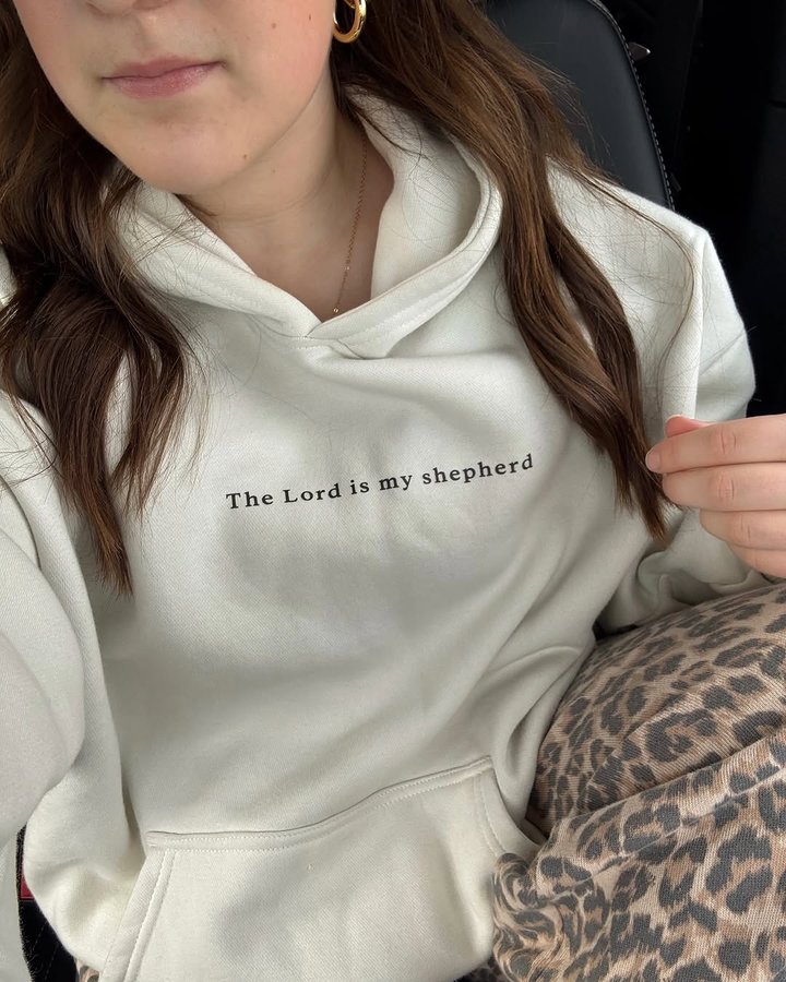 Instagram post by @sundayswithcarli for Elevated Faith. Caption reads: @elevatedfaith put my favorite Psalm on a hoodie....