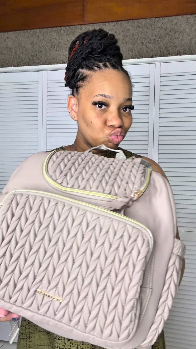 Instagram post by @trisanze_trizzy for Taptap Send. Caption reads: Packing my first-ever baby bag… the reality is....