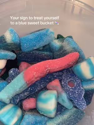 TikTok post by @vlogsandhauls_x for Exploded Sweets. Caption reads: @Exploded Sweets #bluesweets #yoursign [...].