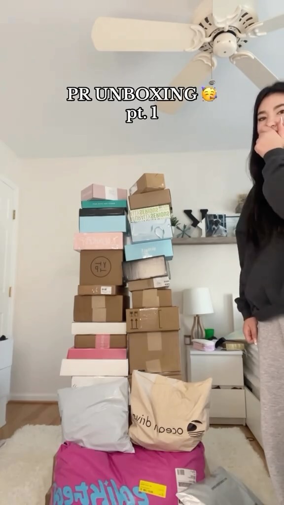 Instagram post by @kayleigh.bursch for Buxom Cosmetics. Caption reads: pr unboxing part 1!! 🙌🙌 @oceandriveclothingco....