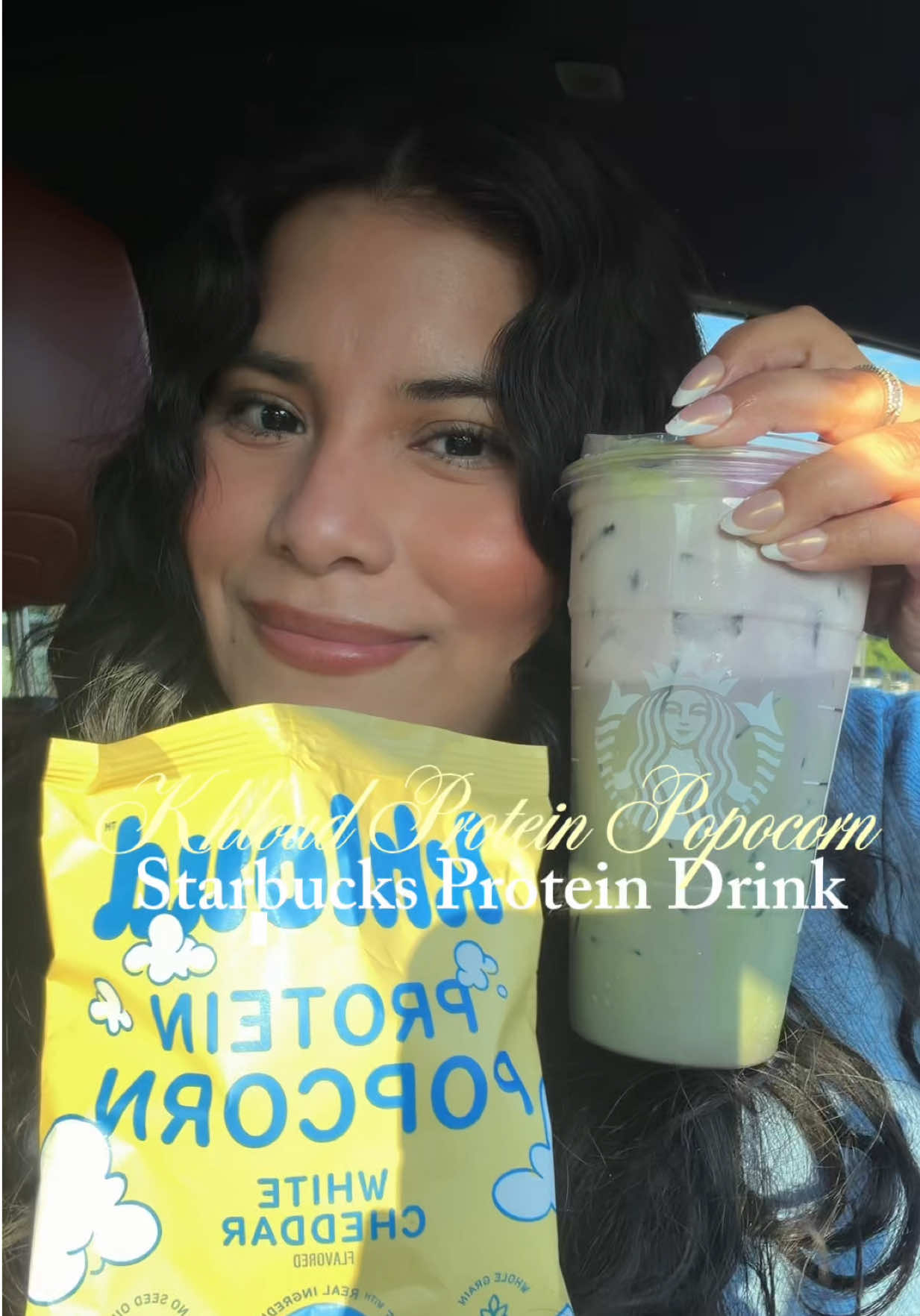 TikTok post by @simplymaryy.v for Khloud. Caption reads: Starbucks drink + Khloud Protein Popcorn will be....