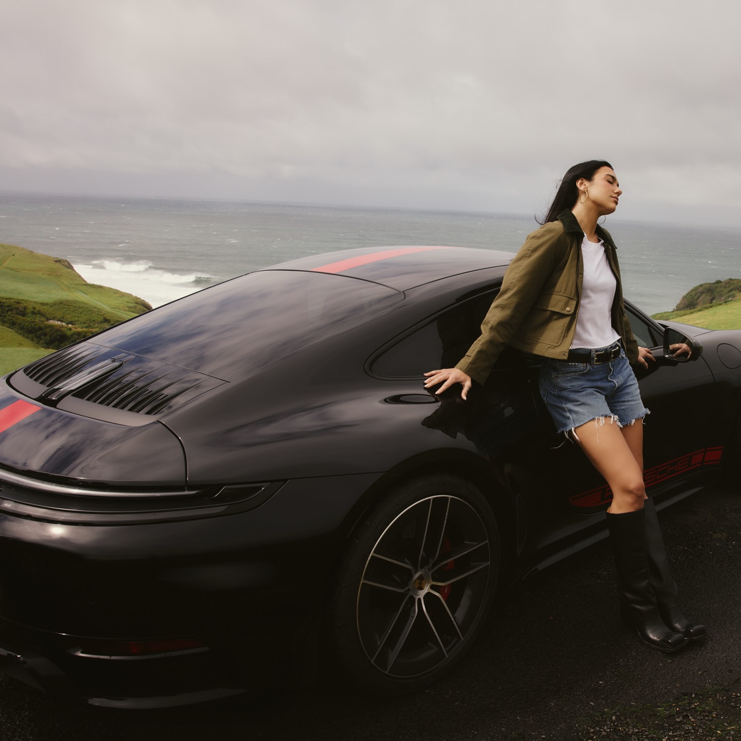 Instagram post by @dualipa for Porsche. Caption reads: always on the road 🚥 @porsche.