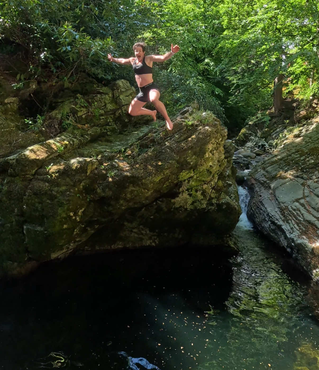 TikTok post by @adventureswithlynne for Discover Northern Ireland. Caption reads: Rock Jumping and swimming up the Shimna River....