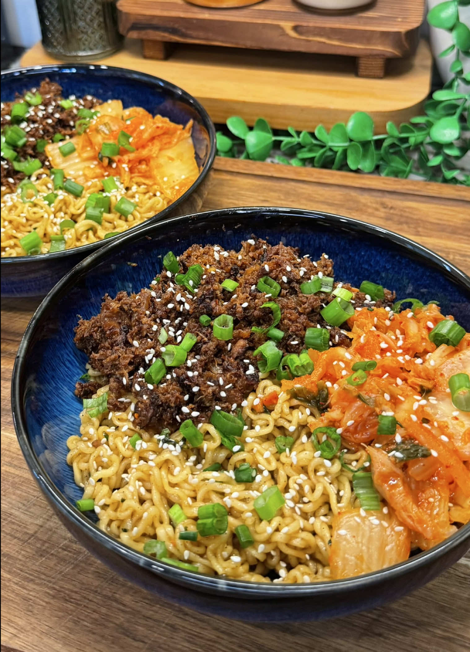 TikTok post by @cookwithauds for Nongshim America. Caption reads: we are SO obsessed with these beef bulgogi noodles....