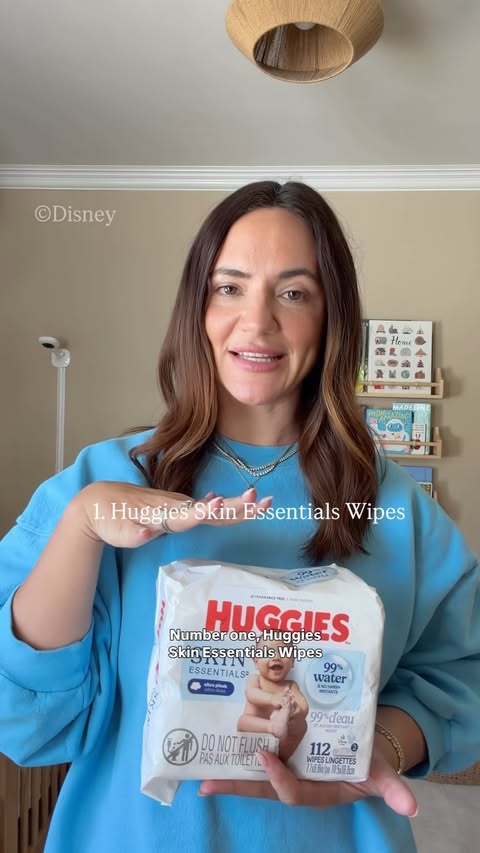 Instagram post by @broccyourbody for Huggies. Caption reads: [...] a heartbeat 🤍 From velcro swaddles to....