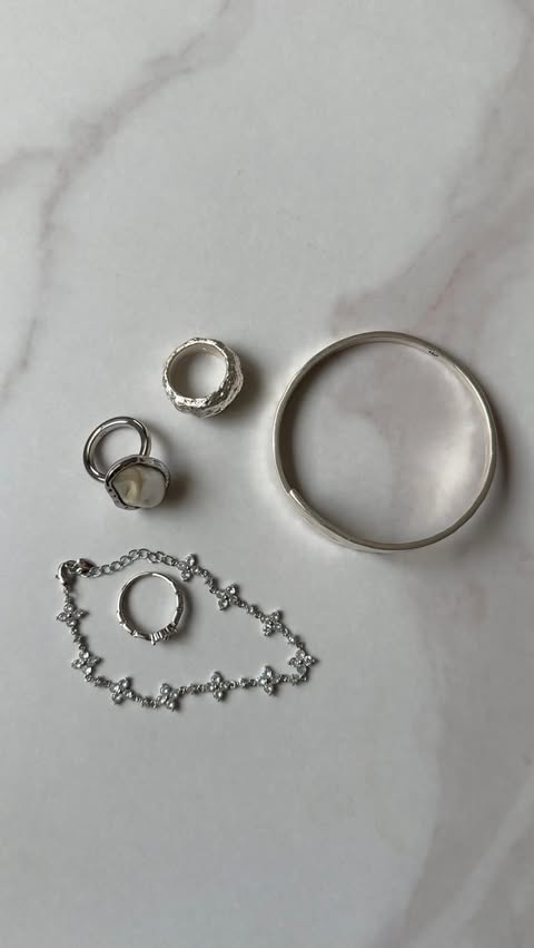 Instagram post by @ketabaia__ for En Route Jewelry. Caption reads: [...] with these silver jewelry pieces ✨....