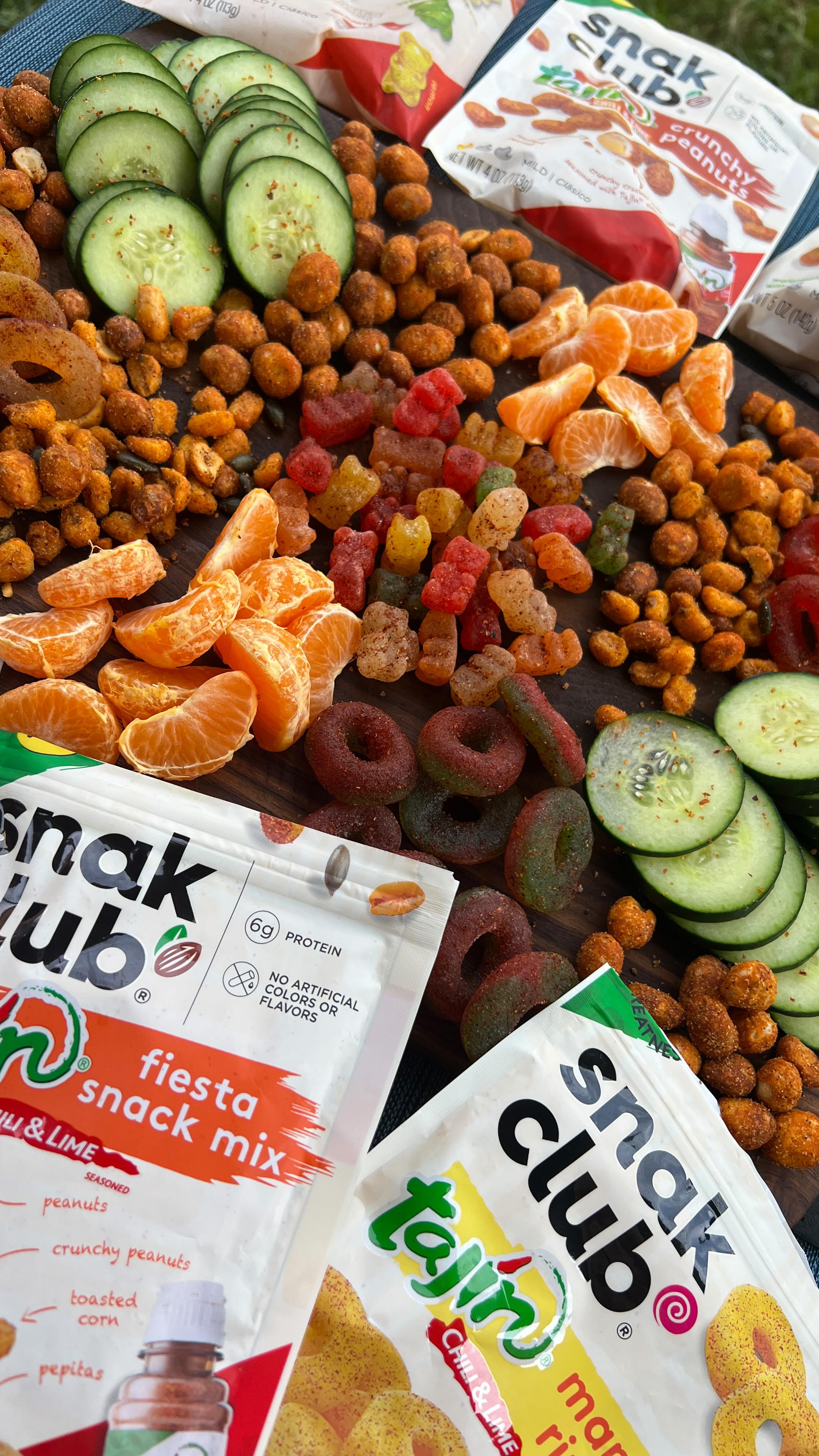 Instagram post by @gimme_comidita for Snak Club. Caption reads: 🚨 SNAK CLUB AND TAJIN 🚨 🍬 Stop scrolling and....