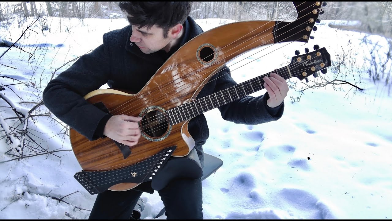 YouTube post by @JamieDupuisMusician for LANDR. Caption reads: We Three Kings - 18 String Harp Guitar....