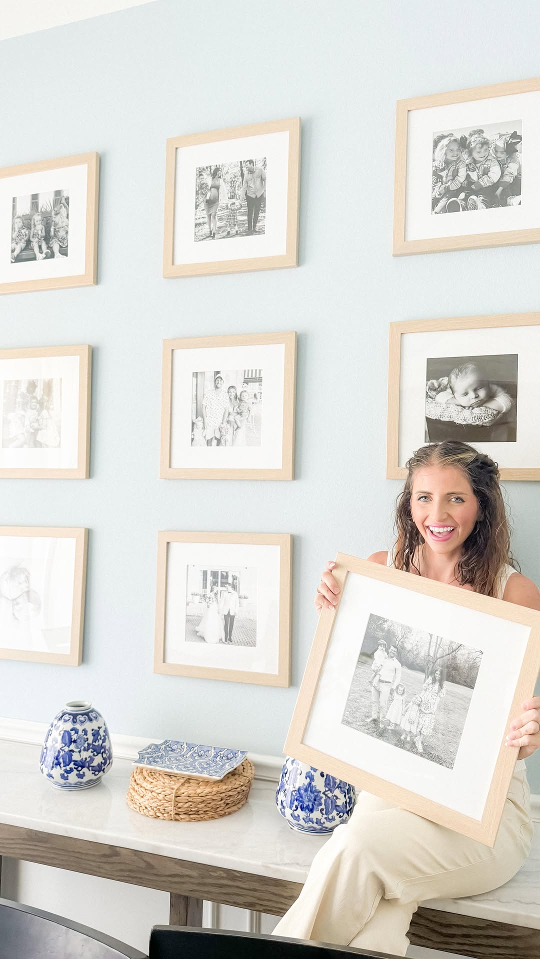 Instagram post by @doubleshotofbabies for Frame It Easy. Caption reads: I’ve always wanted to hang a custom photo wall.....