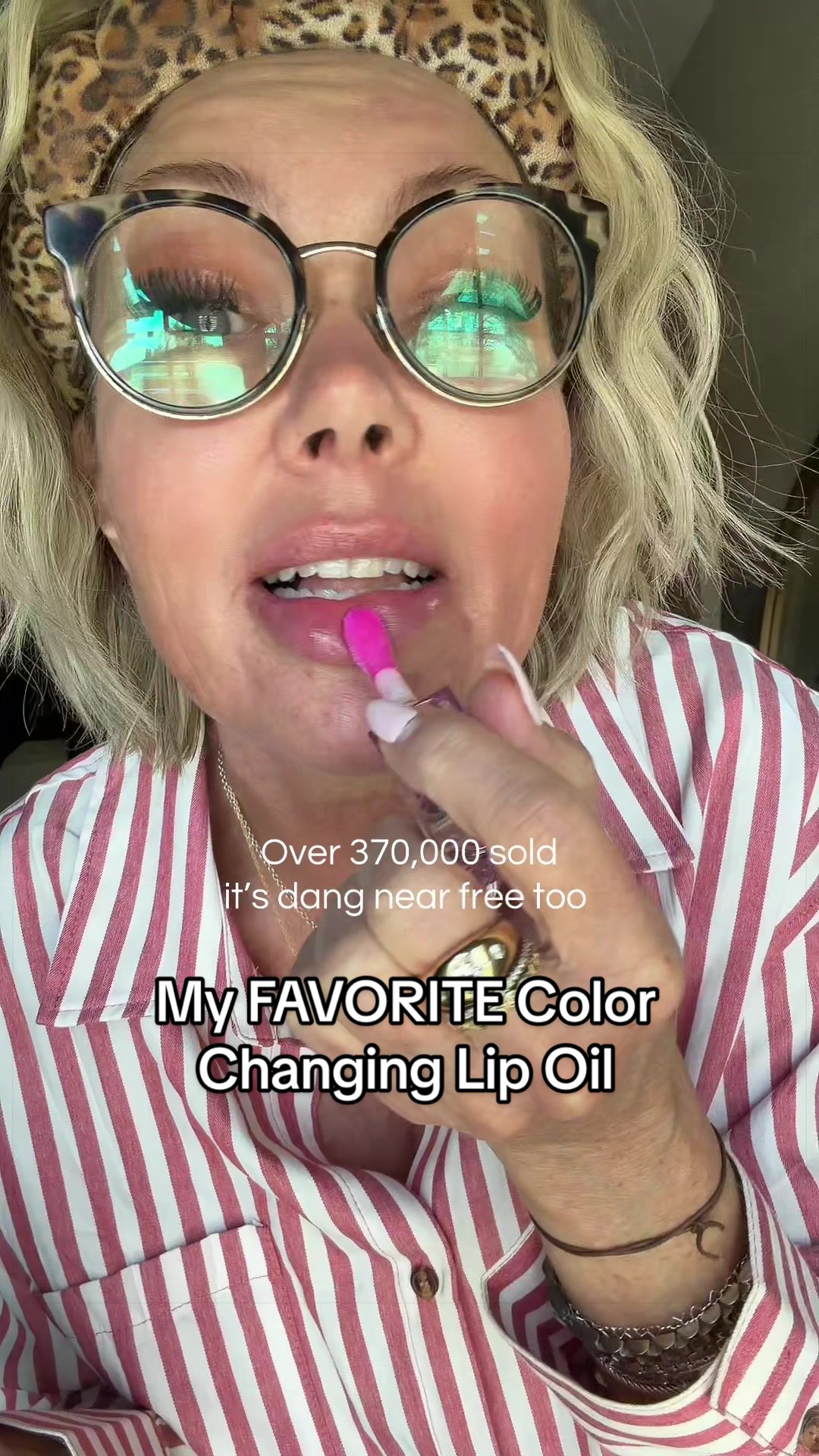 TikTok post by @the.gucci.mom for BossUp Cosmetics. Caption reads: [...] #lipgloss #lipstick #makeup @BossUp....