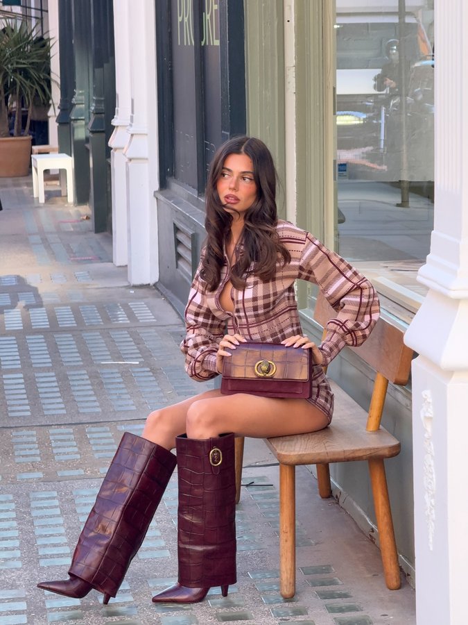 Instagram post by @ashtonwood for Kurt Geiger. Caption reads: it’s boot season @kurtgeiger ❣️❣️.