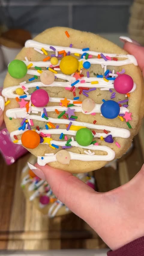 Instagram post by @ashleymarkletreats for Fancy Sprinkles. Caption reads: [...] little treat 🌈🍪 Ingredients:....