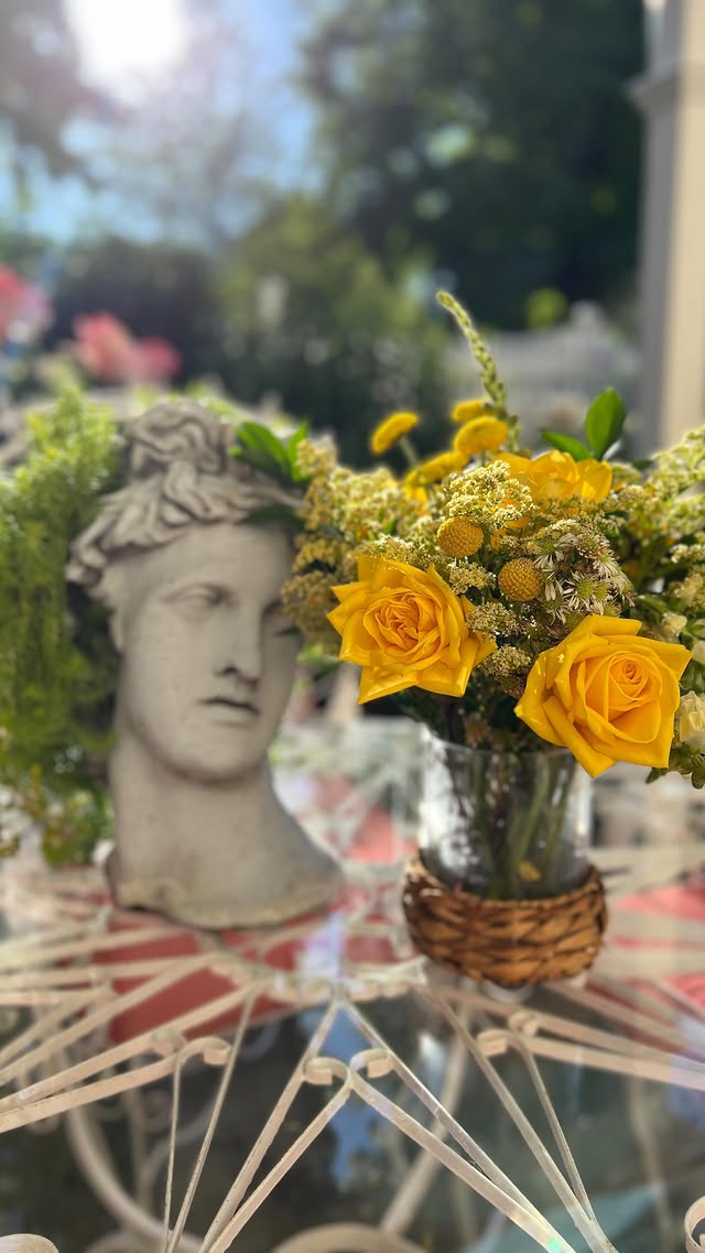 Instagram post by @the_vintage_bombshell for UrbanStems. Caption reads: [...] time of year in the garden with @urbanstems....