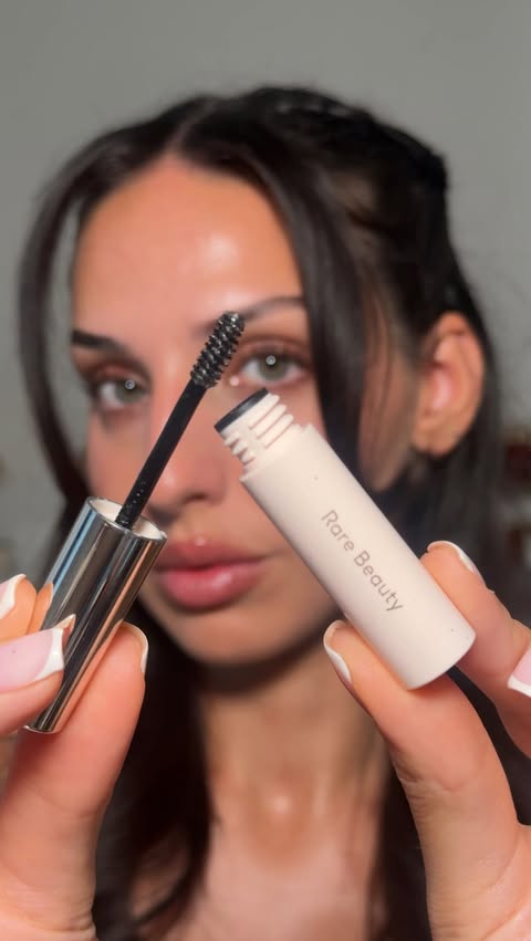 Instagram post by @naomimizrahi for LOOKFANTASTIC. Caption reads: [...] brown” Discount codes (affiliate)....