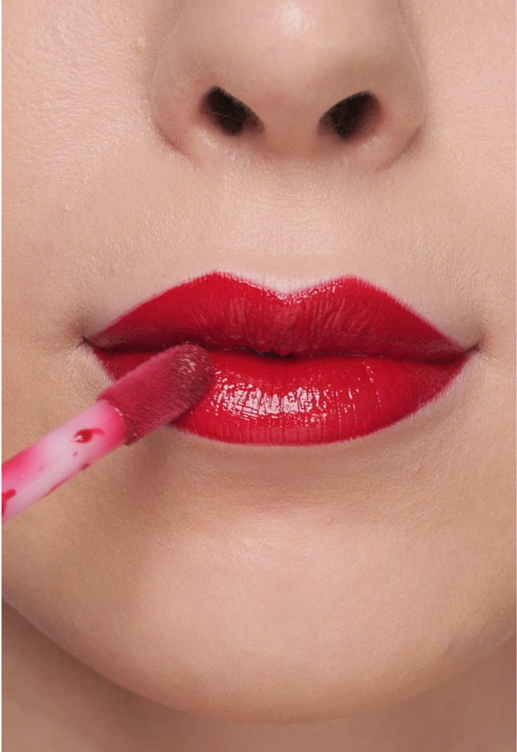 TikTok post by @ashleykaylamakeup for OFRA Cosmetics. Caption reads: Glossy red lip look using the @OFRA Cosmetics, LLC....