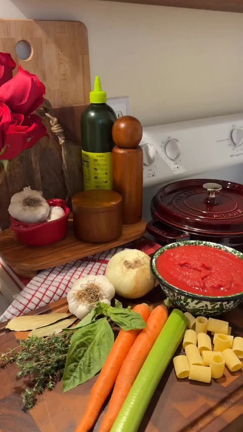 Instagram post by @elizgreaves for ZWILLING. Caption reads: braised beef ragu cooked in my @staub_usa 4 qt....