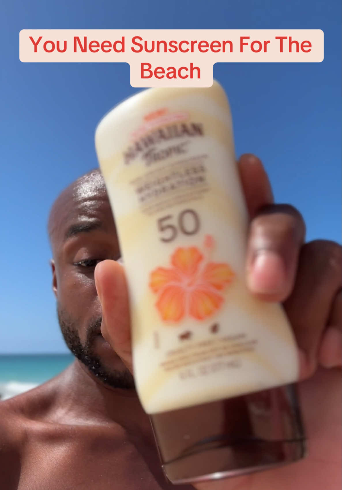 TikTok post by @tyreaktoldyou for Hawaiian Tropic. Caption reads: [...] at the beach without any sunscreen!....