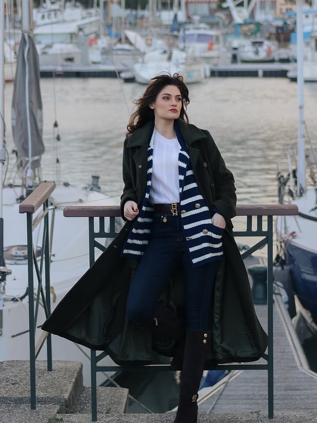 Instagram post by @minakshi.mahta for Holland Cooper. Caption reads: By the sea 🌊 

@hollandcooperclothing denim pant....