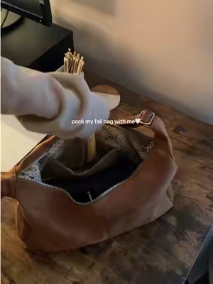 TikTok post by @juliasfindsx for KKXIU Chain Store. Caption reads: time to go get coffee☕️🍁🧸 #purse #baghaul #diml....